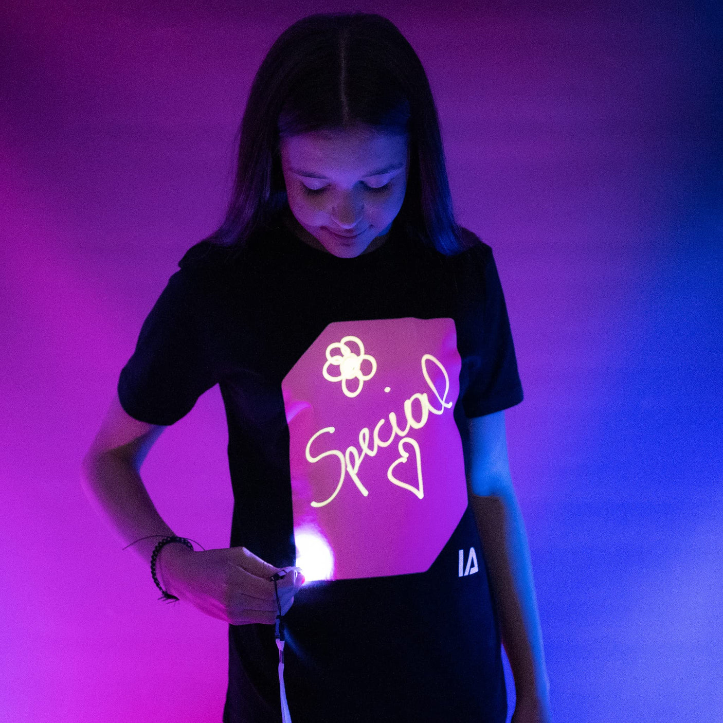 Illuminated Apparel Original Interactive Glow in The Dark T-Shirt - Fun for Birthday Parties & Festivals